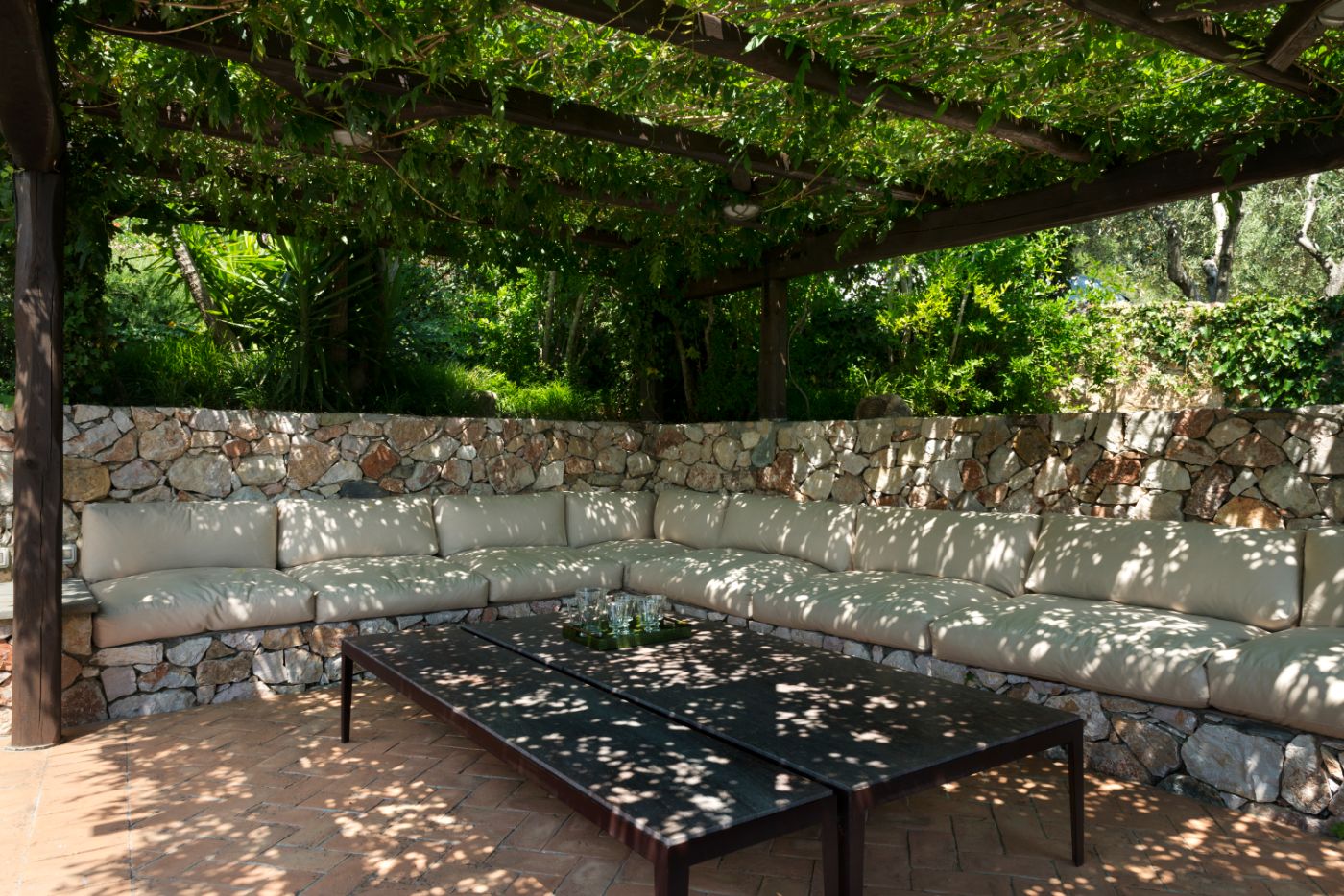 A seating area beside the pool at La Feniglia.