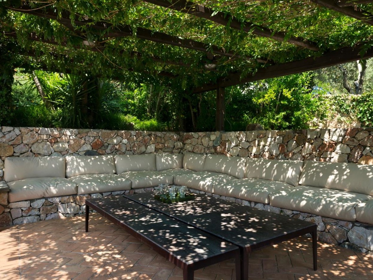 A seating area beside the pool at La Feniglia.