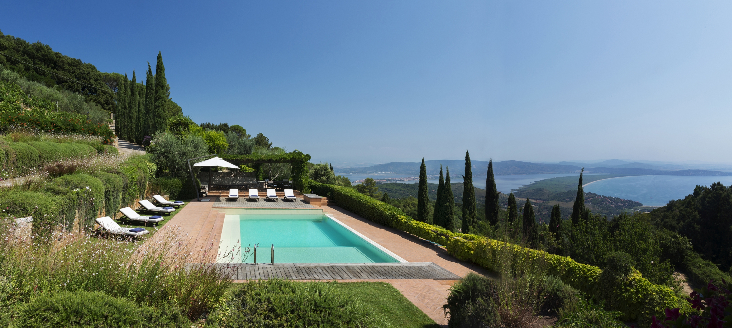 Swimming pool and view from La Feniglia, Tuscany