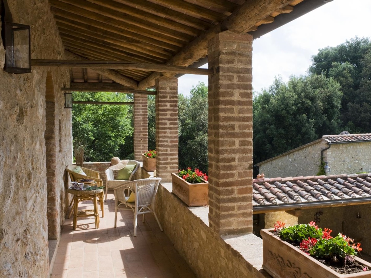 Balcony with chairs & flowers at La Gavelli in Tuscany, Italy