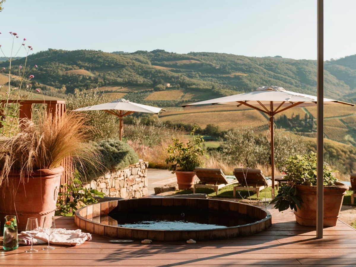 Outdoor hot tub overlooking the pool area at La Regina in Tuscany