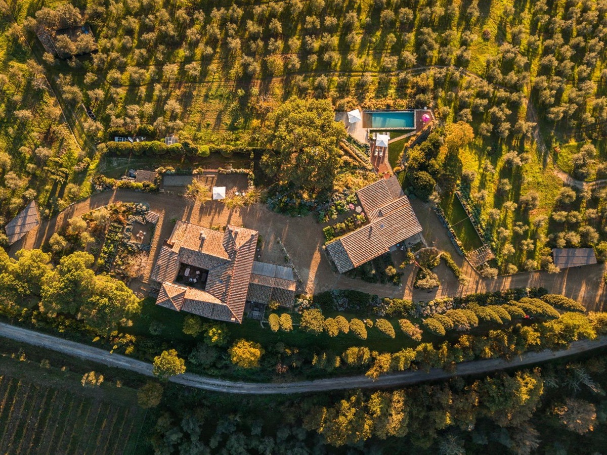 Overhead drone view of La Regina in Tuscany with view of the buildings and pool area