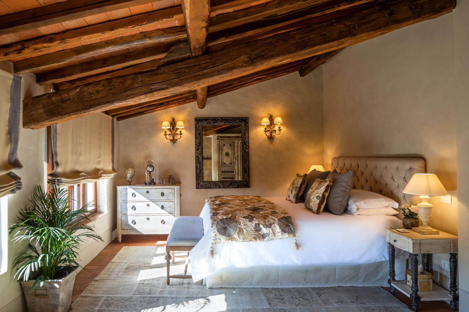 Double bedroom with beamed ceiling at la tenuta, tuscany