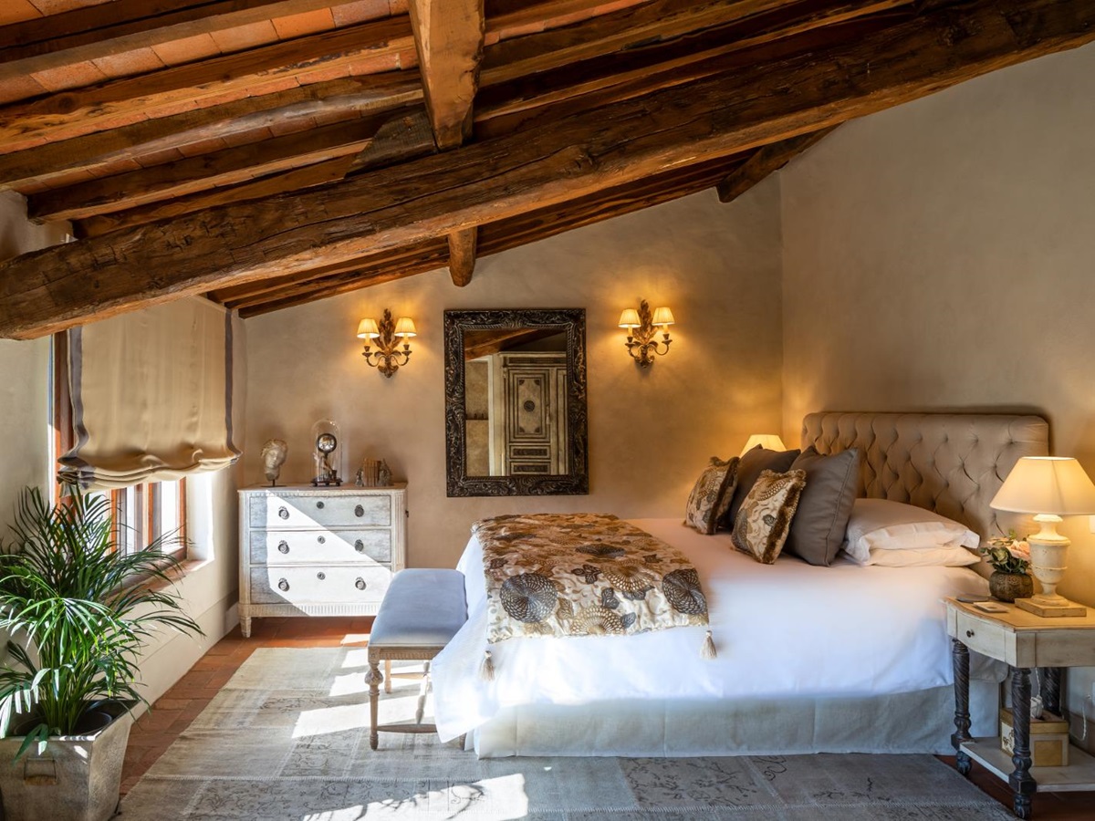 Double bedroom with beamed ceiling at la tenuta, tuscany