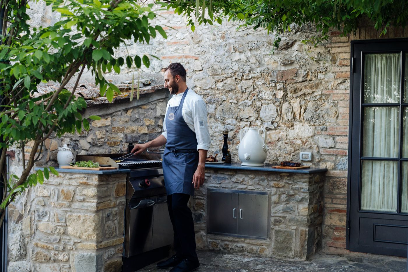A chef prepares delicious food at La Tenuta.