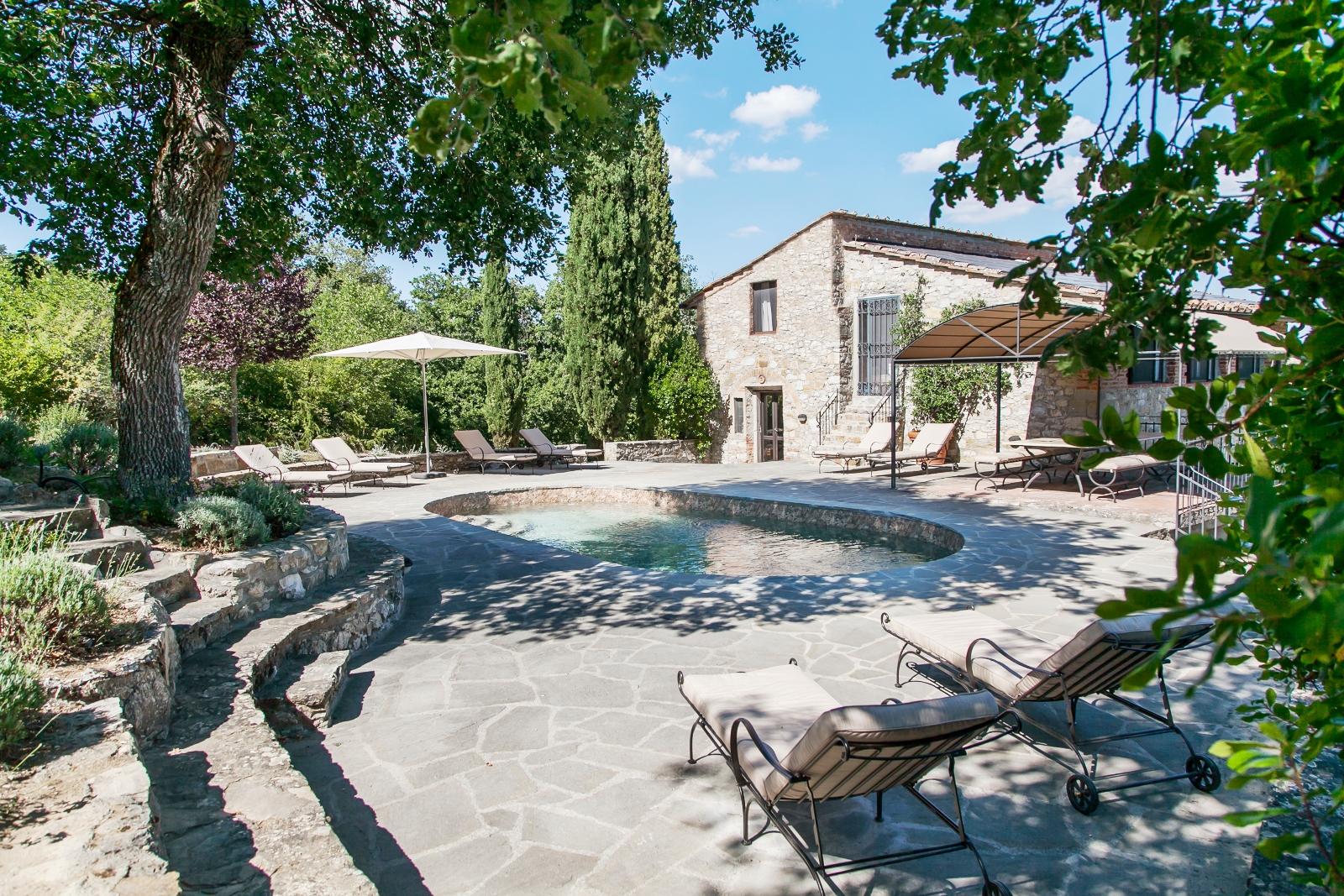 Swimming pool and facade of La Tenuta, Tuscany