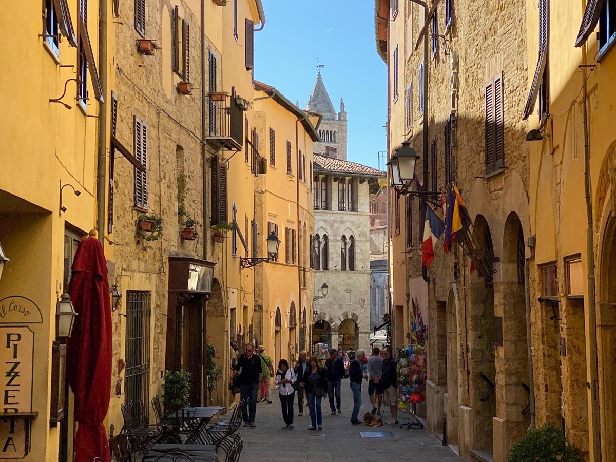 Colourful street with shops and cafés in Massa Marittima near La Vigna in Tuscany, Italy