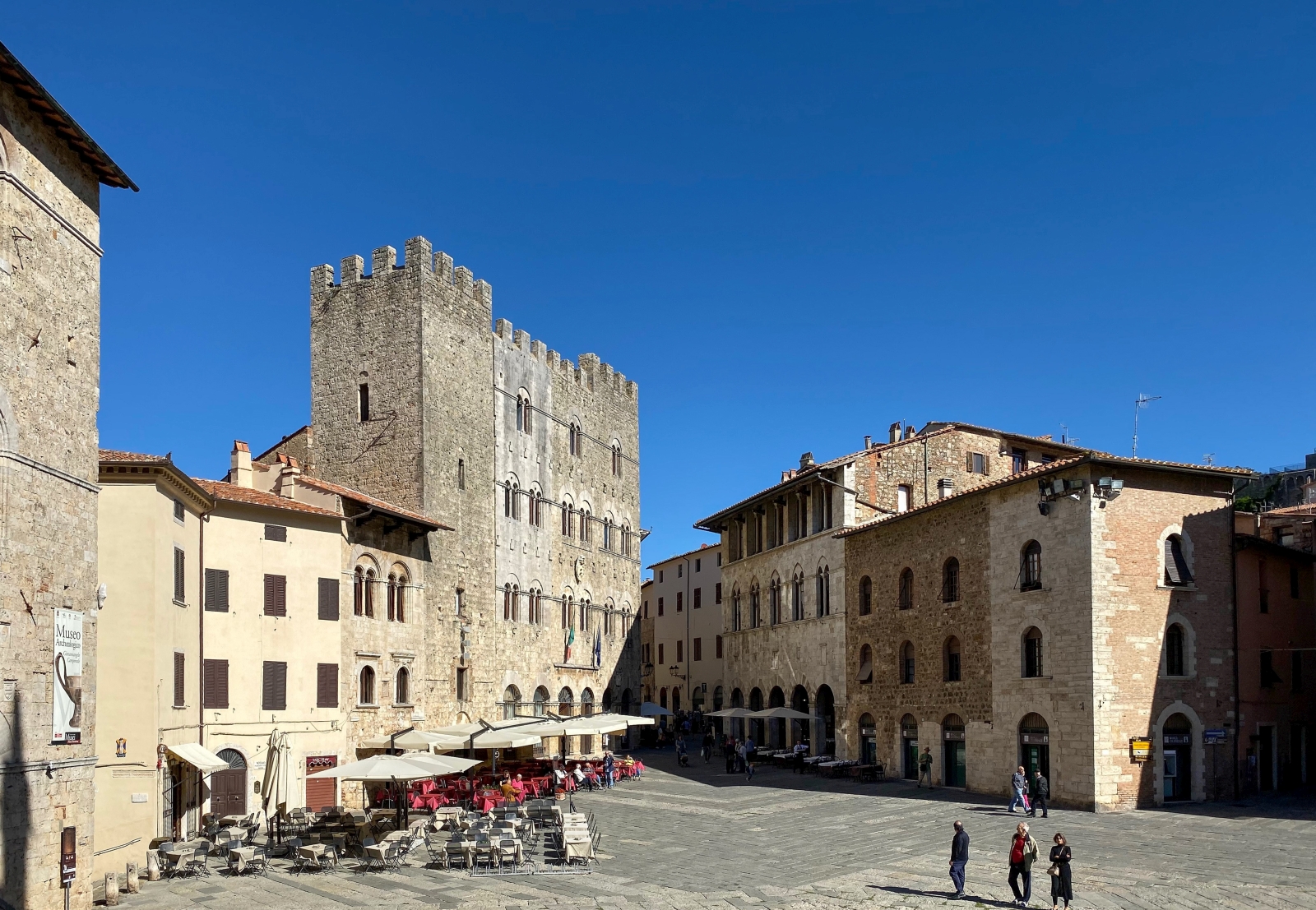 Square with cafés and restaurants near cathedral in Massa Marittima near La Vigna in Tuscany, Italy