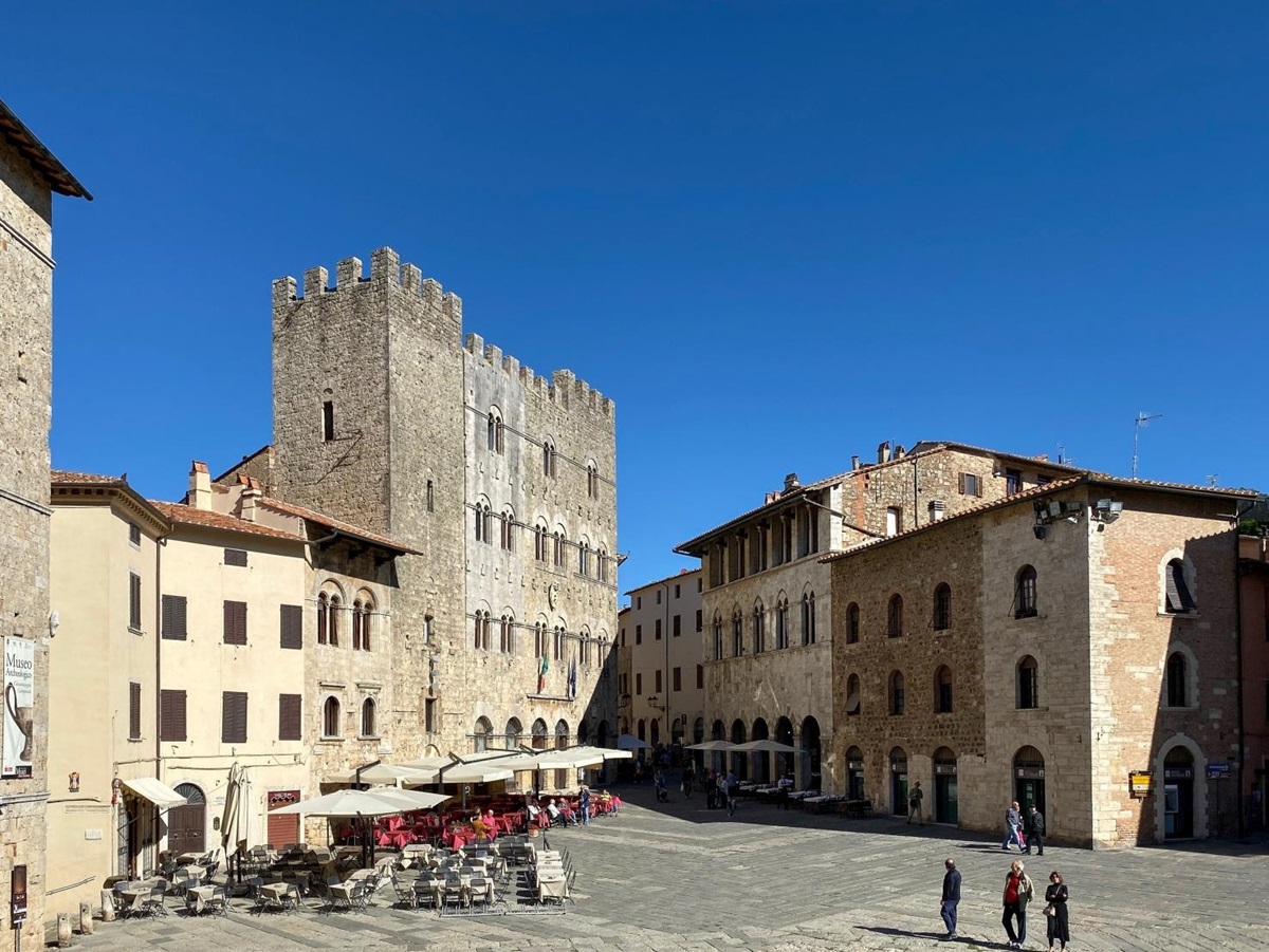 Square with cafés and restaurants near cathedral in Massa Marittima near La Vigna in Tuscany, Italy