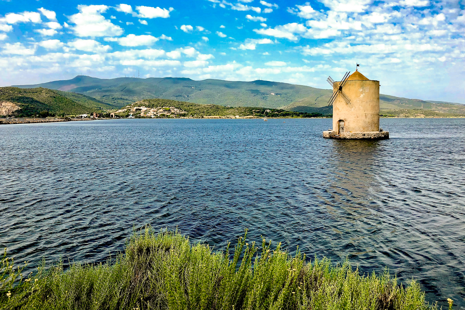 A windmill on the lake in Ortobello, Tuscany
