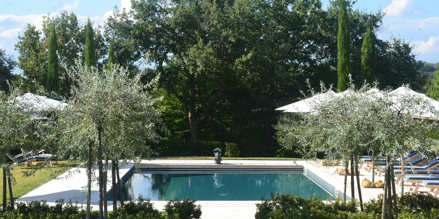 The swimming pool on a summer's day at Podere Caterina.
