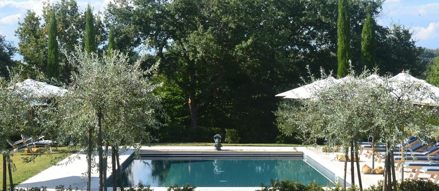 The swimming pool on a summer's day at Podere Caterina.