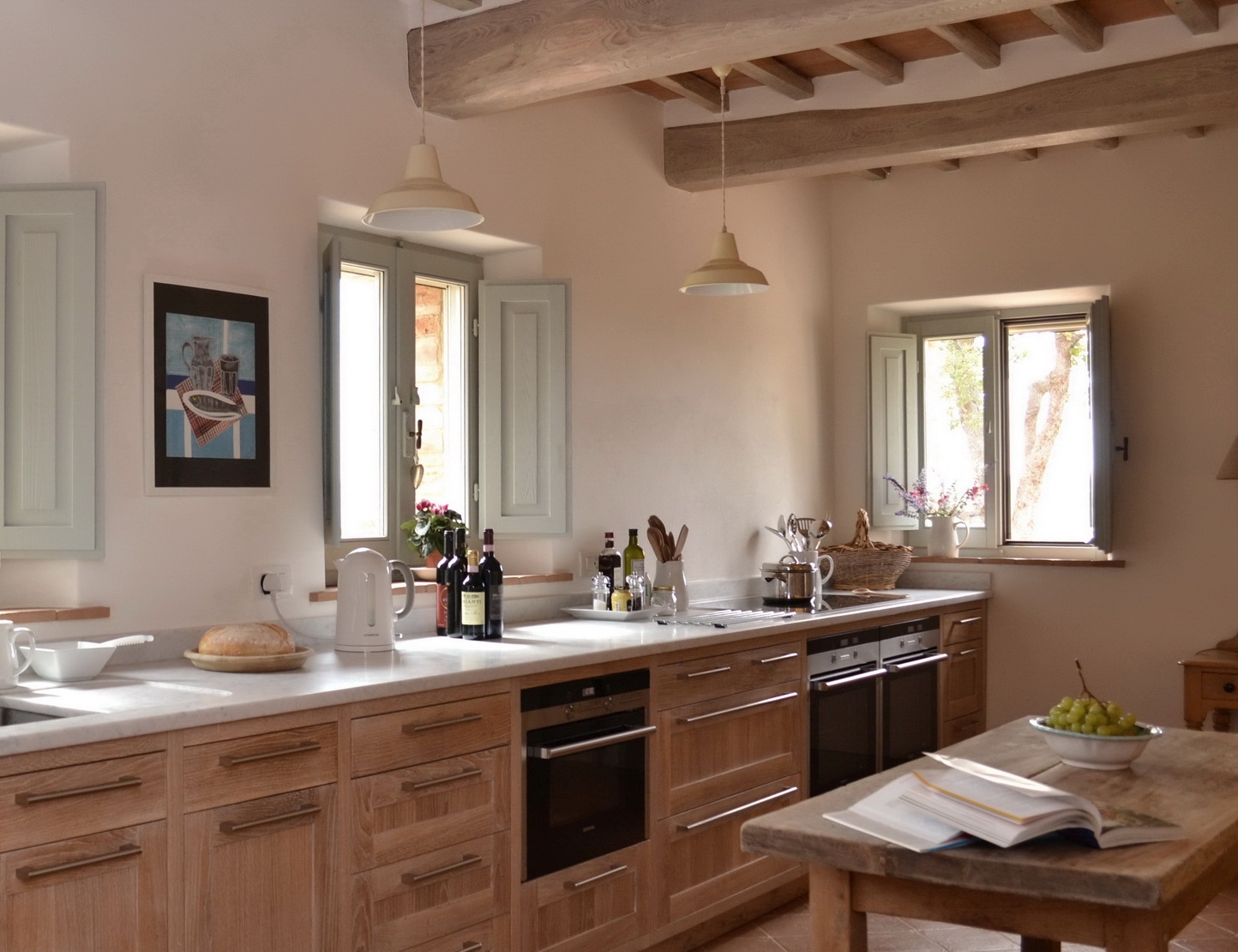 Kitchen surfaces with two windows above at Podere Caterina in Tuscany