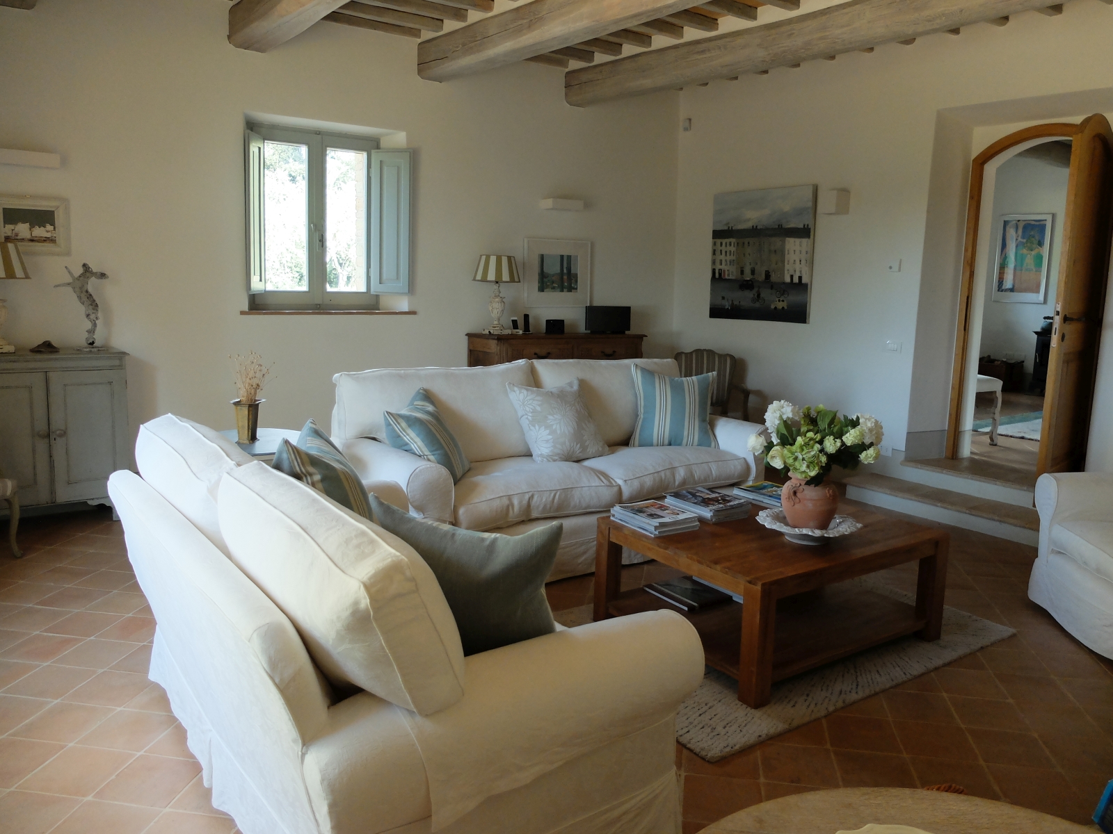 White sofas in living room at Podere Caterina in Tuscany