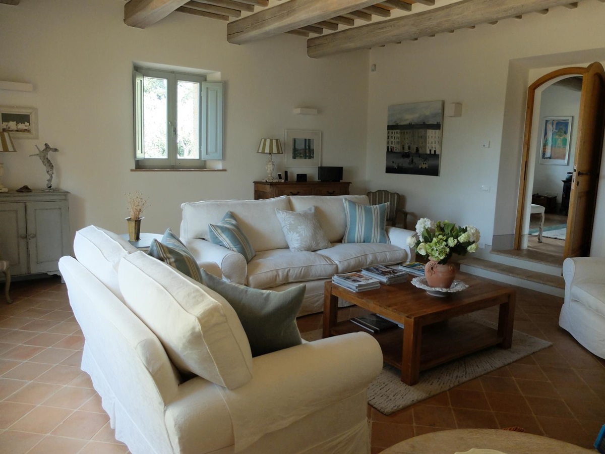 White sofas in living room at Podere Caterina in Tuscany
