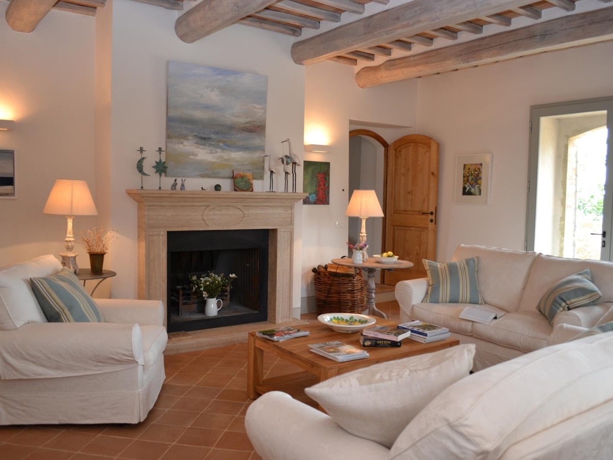 Living room with white sofas at Podere Caterina Tuscany