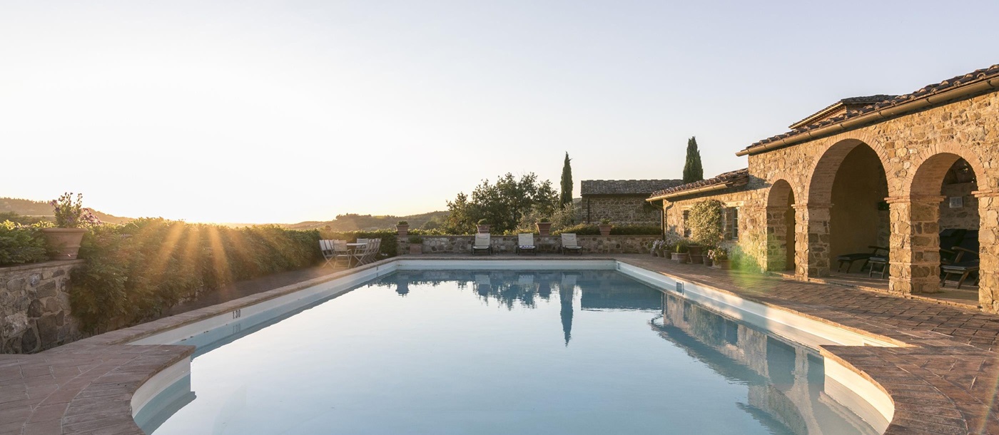 Swimming pool during sunset of Podere Cipressi, Tuscany