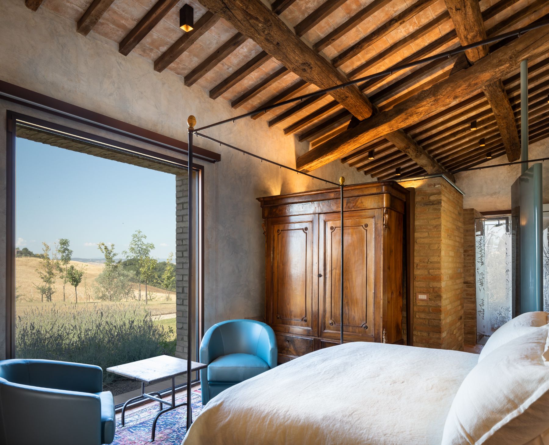 Double bedroom with window view at Podere Martino in Tuscany