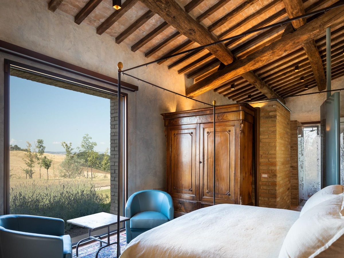 Double bedroom with window view at Podere Martino in Tuscany