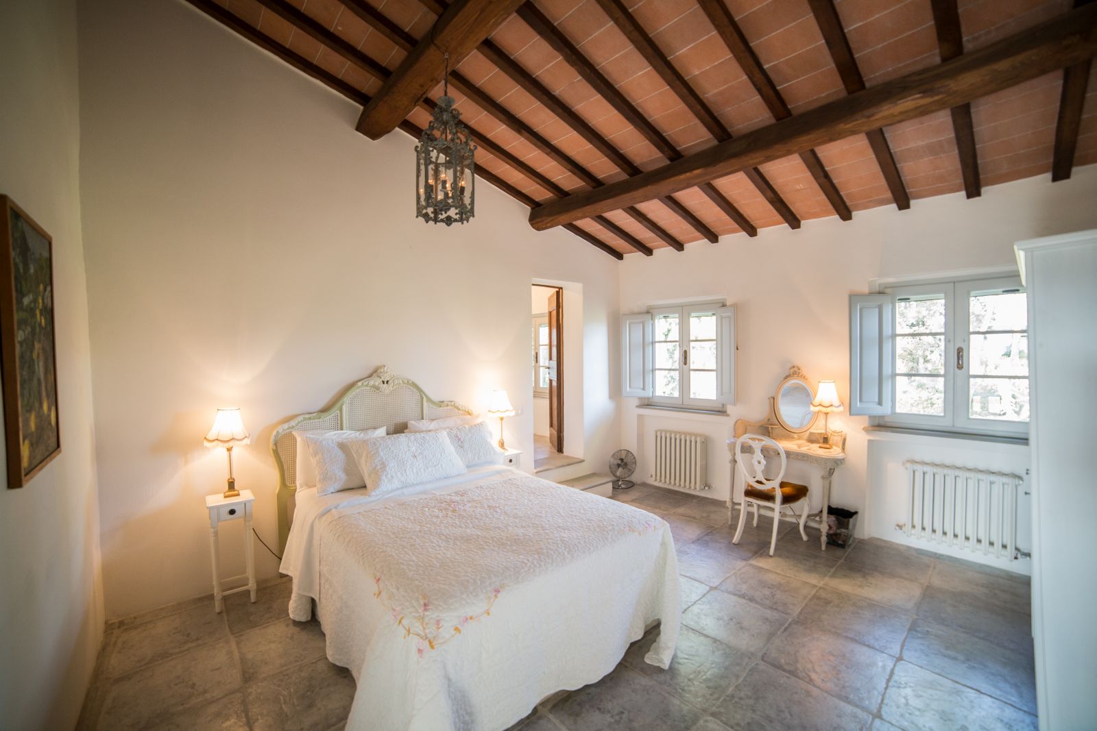 A double bedroom in the farmhouse at Tenuta La Contessa