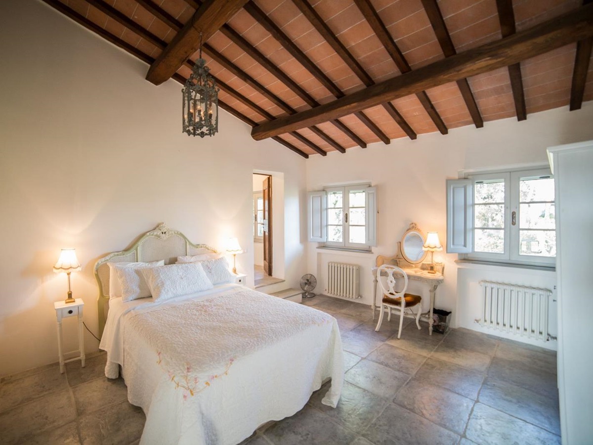 A double bedroom in the farmhouse at Tenuta La Contessa