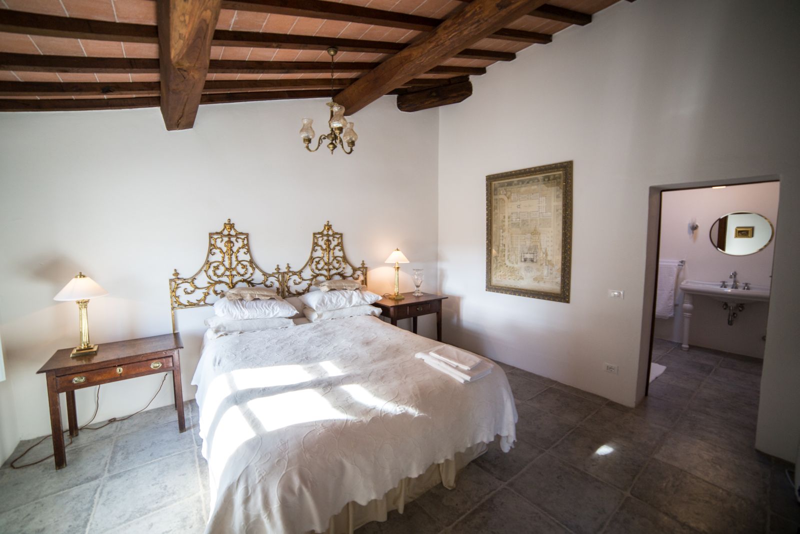 A bedroom in the farmhouse at Tenuta La Contessa