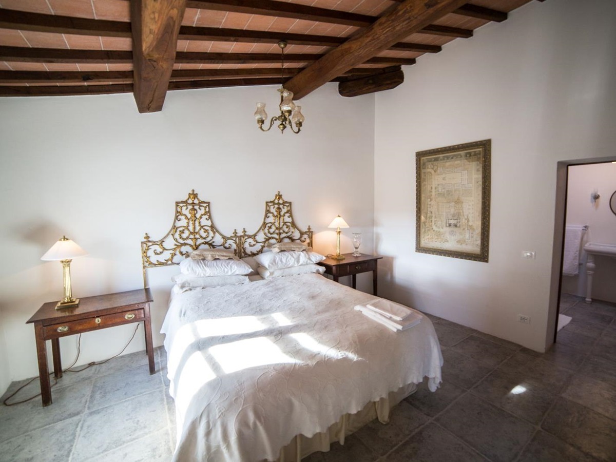 A bedroom in the farmhouse at Tenuta La Contessa