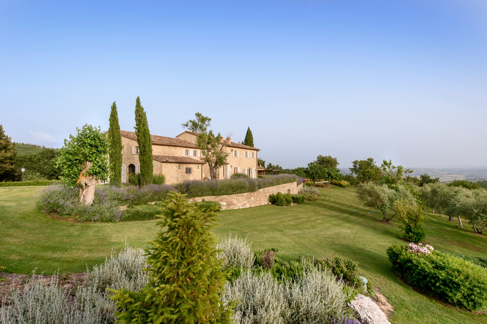 Exterior view of villa, gardens and countryside view at Tramonti in Tuscany, Italy