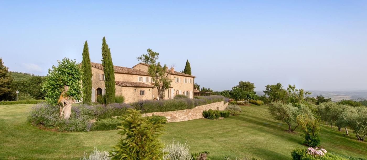 Exterior view of villa, gardens and countryside view at Tramonti in Tuscany, Italy