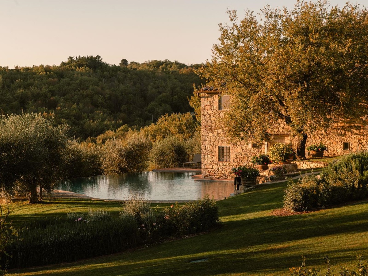Second pool area with view of the gardens and villa at Tramonti in Tuscany