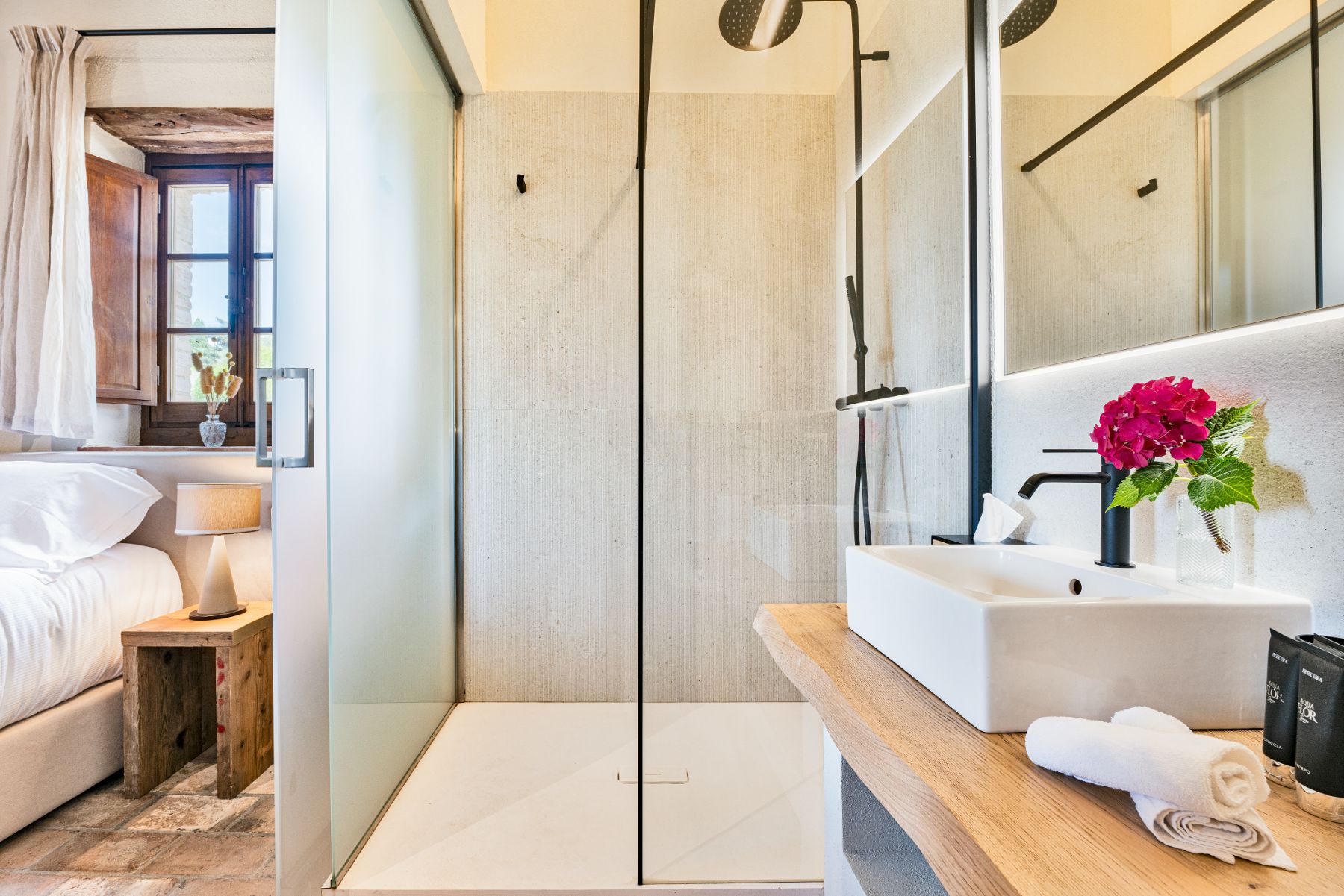 Ensuite bathroom with view of the shower and basin at Villa Cispiano in Tuscany
