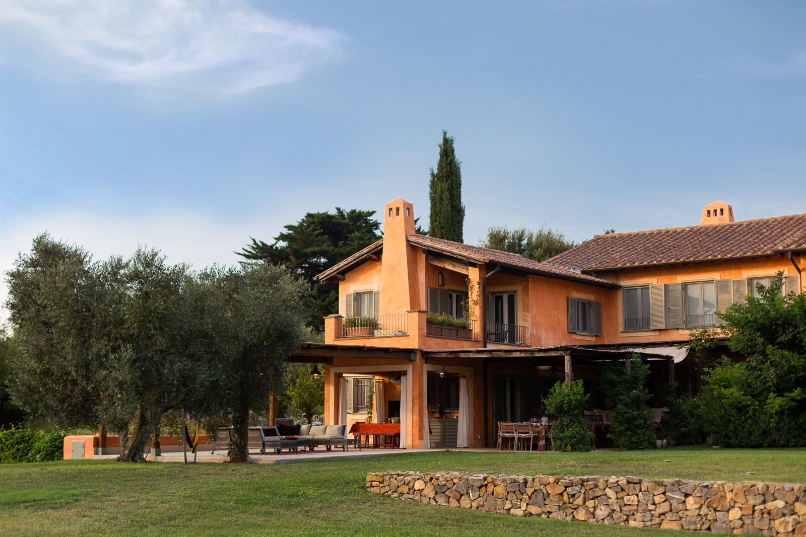 Exterior of villa with blue sky at Villa del Gelso, Tuscany