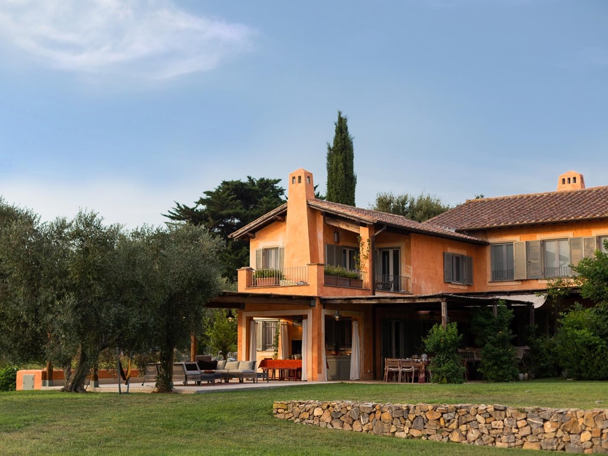 Exterior of villa with blue sky at Villa del Gelso, Tuscany