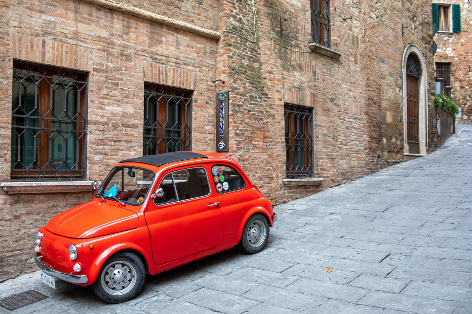 Fiat 500 in small street in town near to Villa dell'Angelo in Tuscany