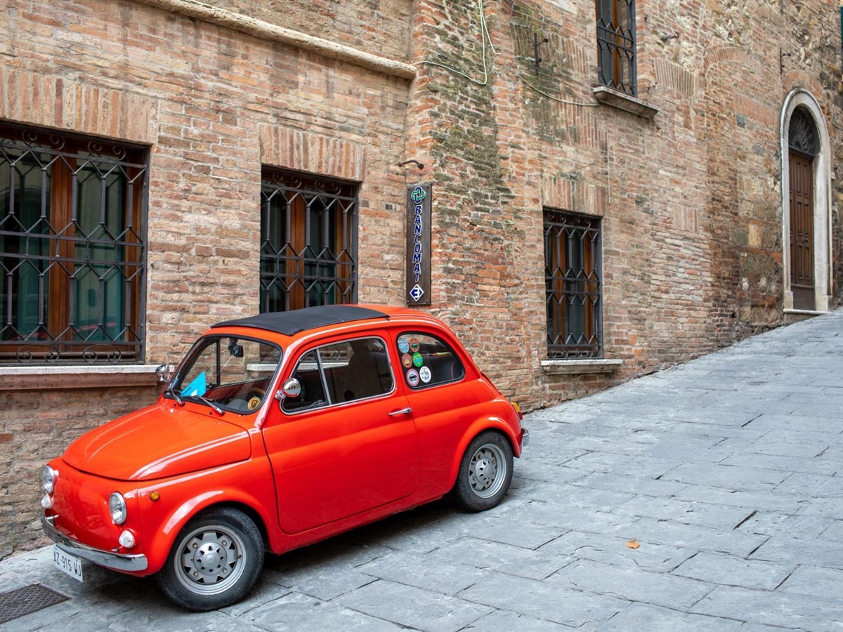 Fiat 500 in small street in town near to Villa dell'Angelo in Tuscany