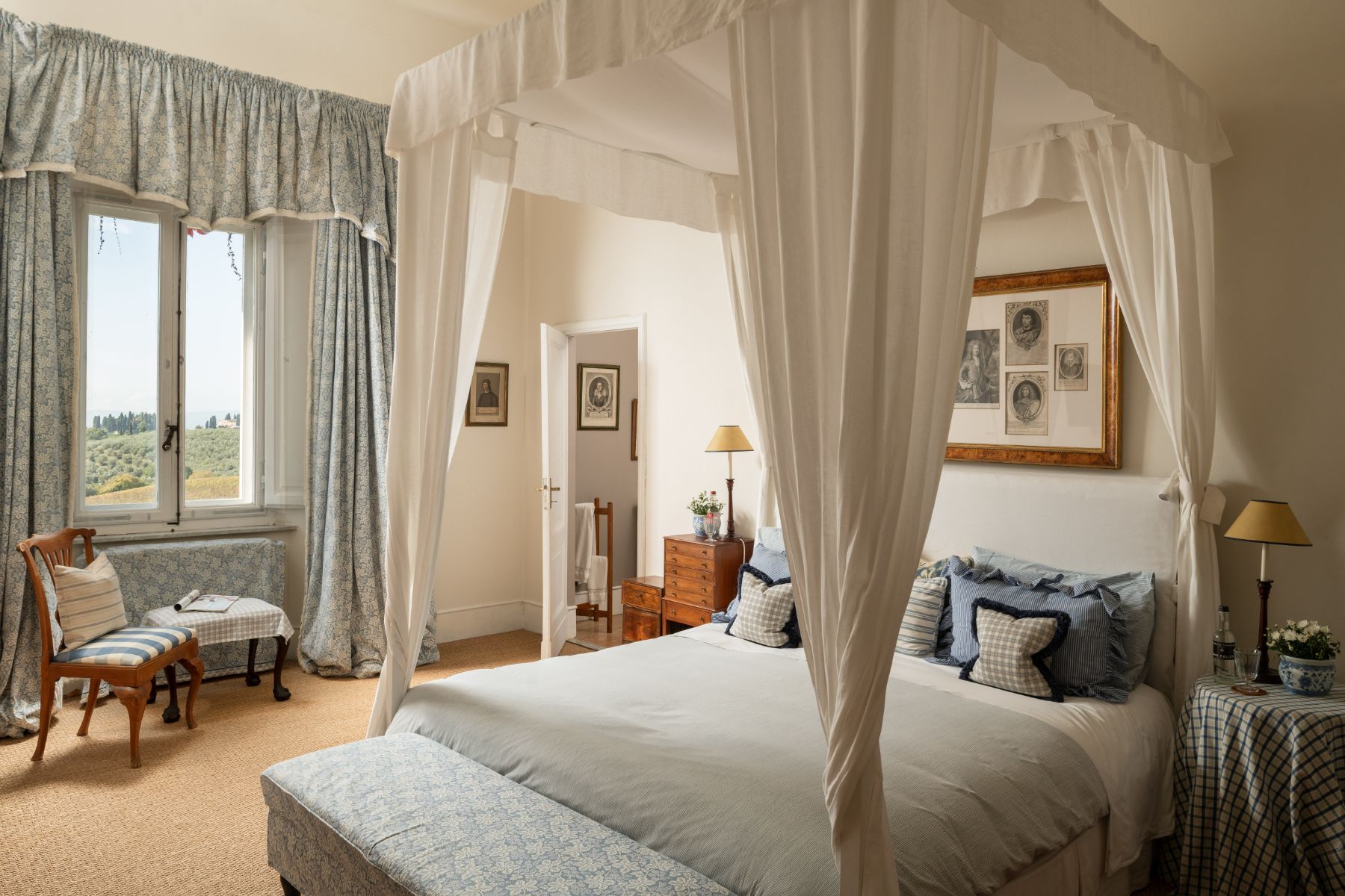 Large bedroom with double bed and large window at Villa delle Vigne in Tuscany