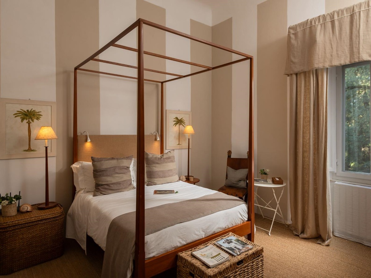Bedroom with double bed and large window at Villa delle Vigne in Tuscany