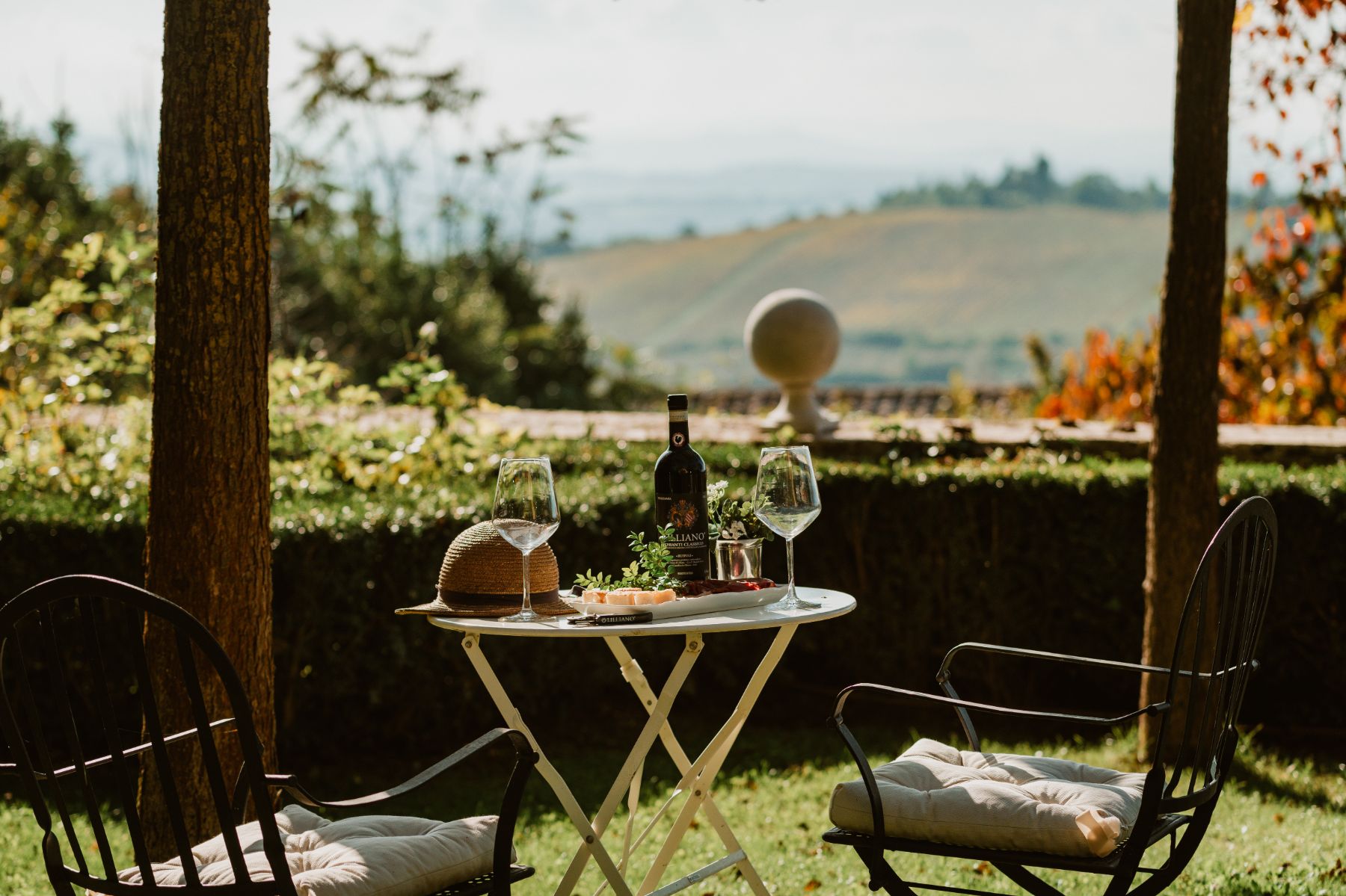 Outdoor coffee table by the pool area at Villa delle Vigne in Tuscany