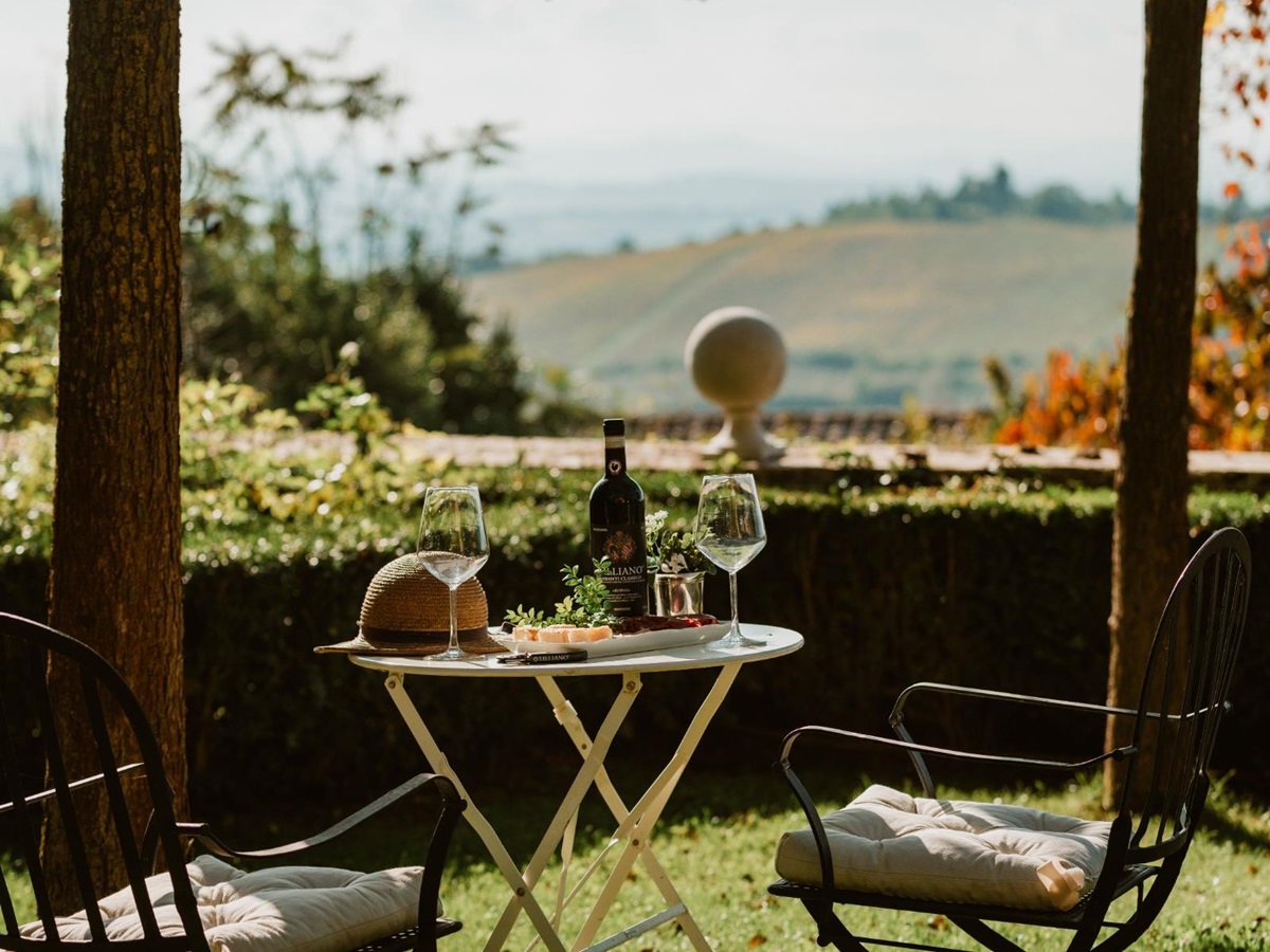 Outdoor coffee table by the pool area at Villa delle Vigne in Tuscany