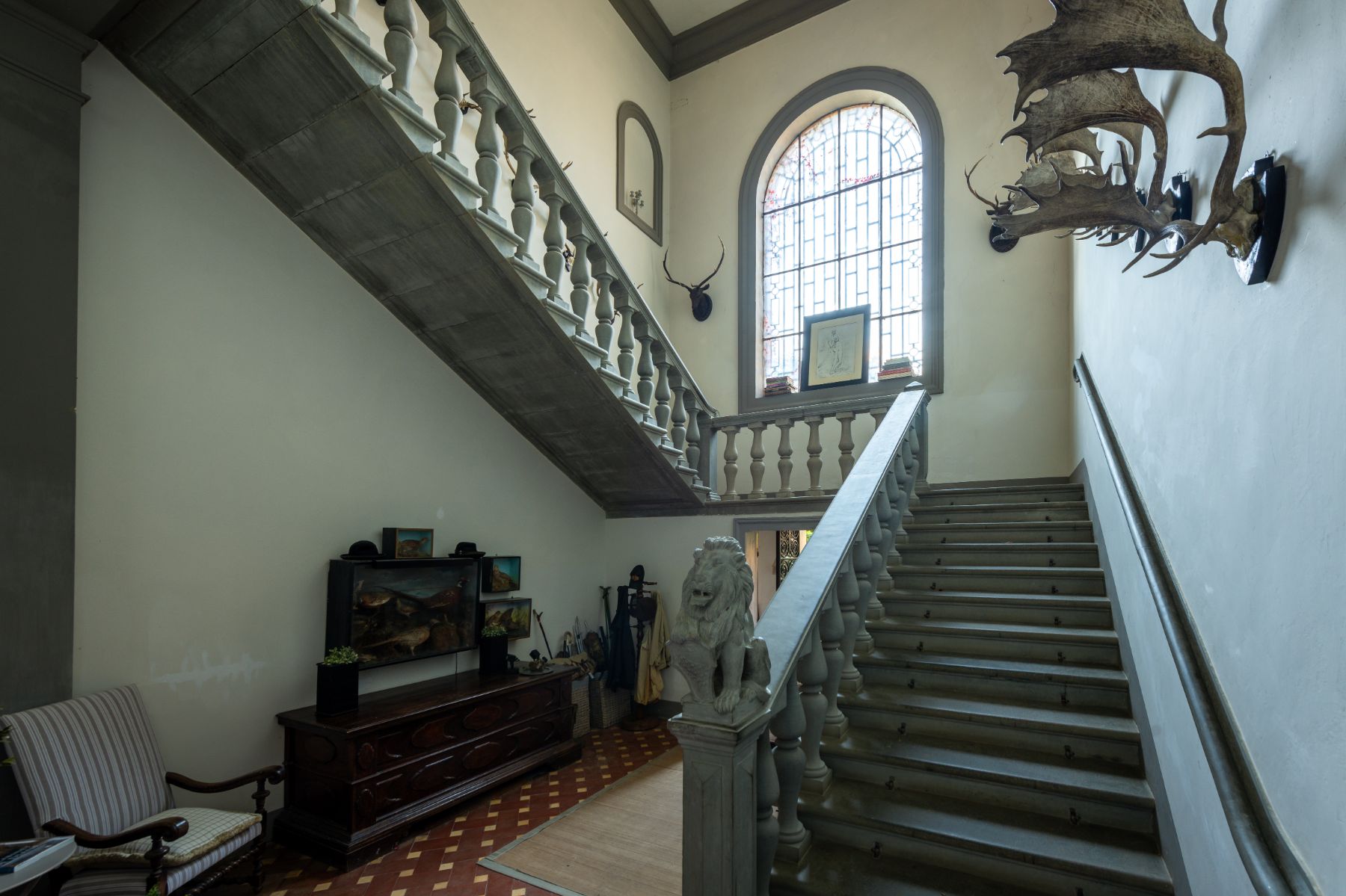 Stairs indoors at Villa delle Vigne in Tuscany with a large window