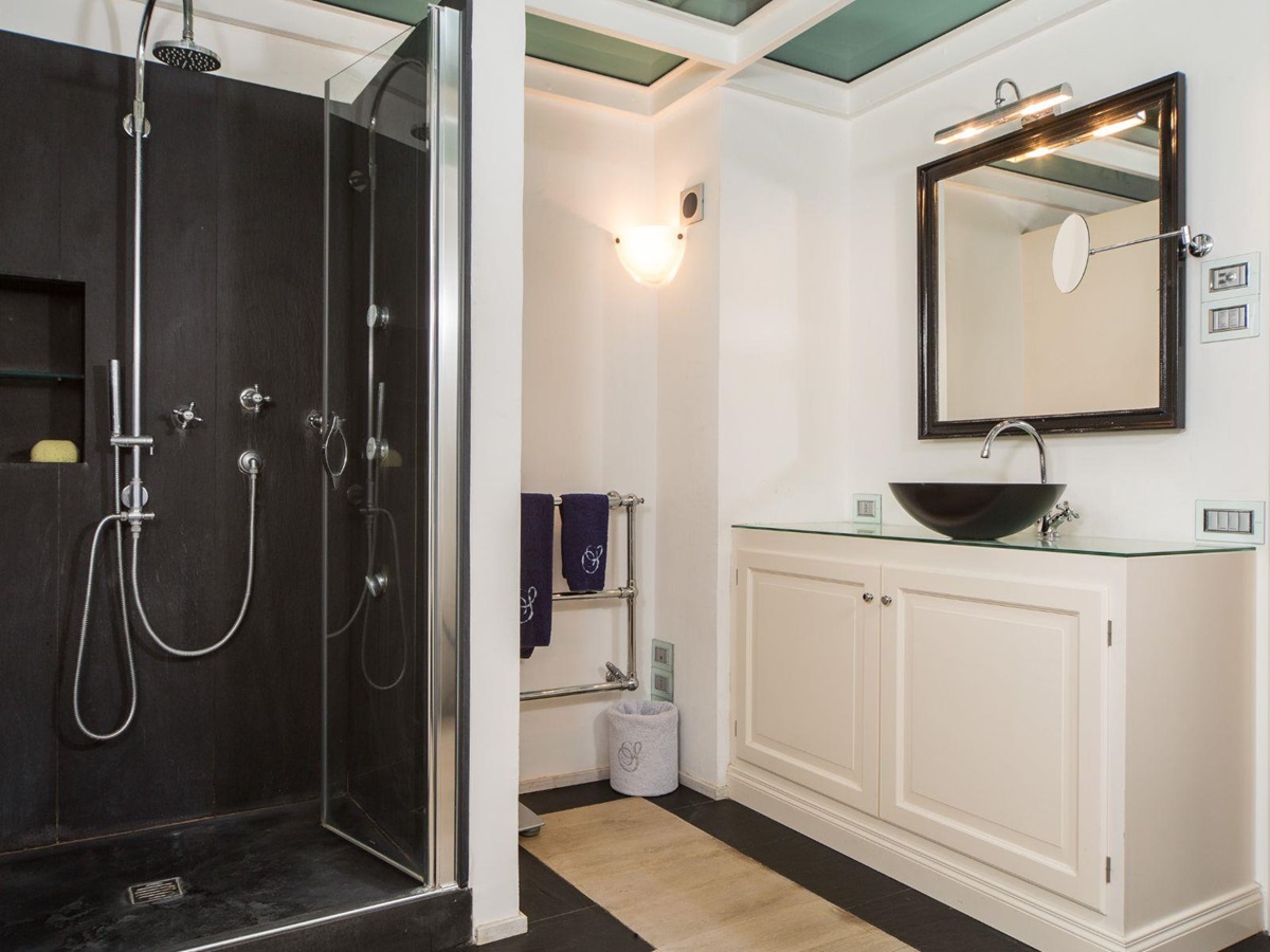 Ensuite bathroom with shower and basin at Villa di Tignano in Tuscany