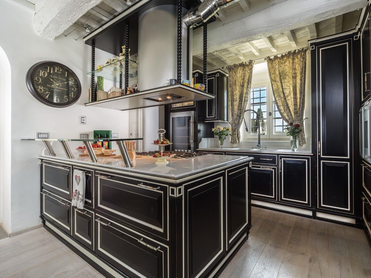 Kitchen in the main villa at villa di Tignano in Tuscany with black furniture