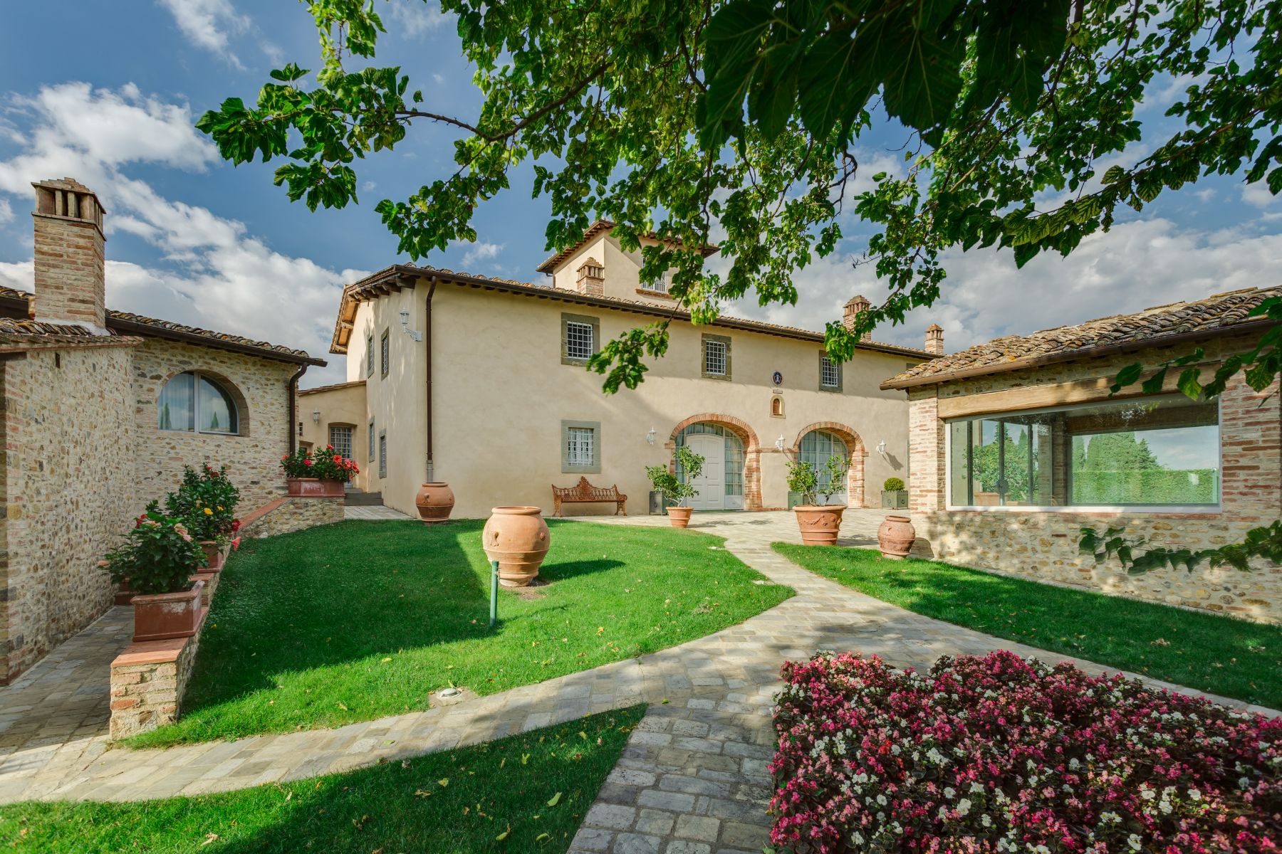 View of the outdoor area with view of the main villa gym building and the dependence