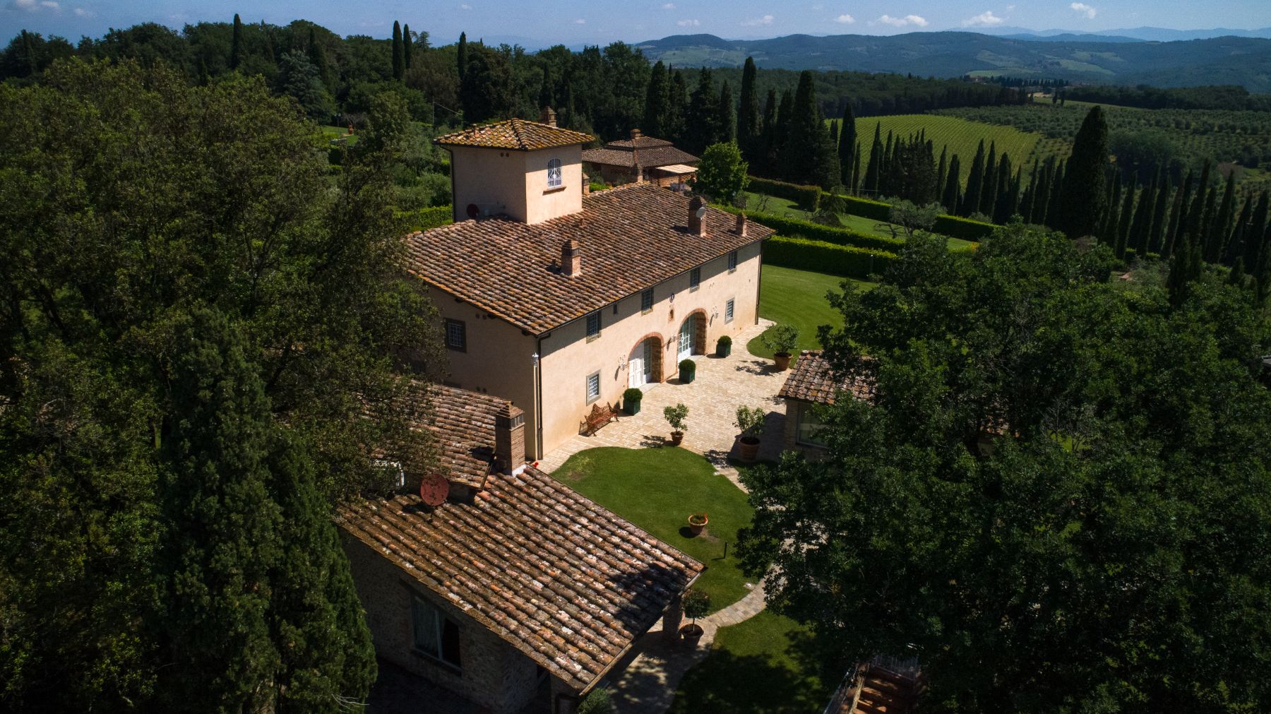 View of the main villa and the dependence building to the left at Villa di Tignano in Tuscany