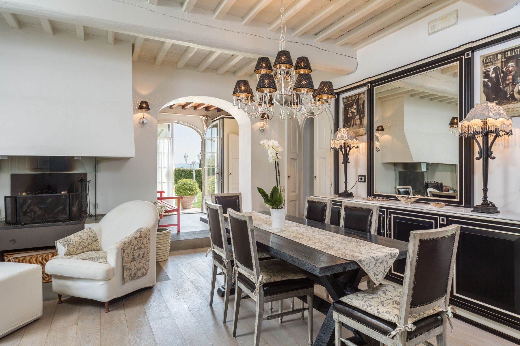 Indoor dining room in the kitchen with black furniture at Villa di Tignano in Tuscany