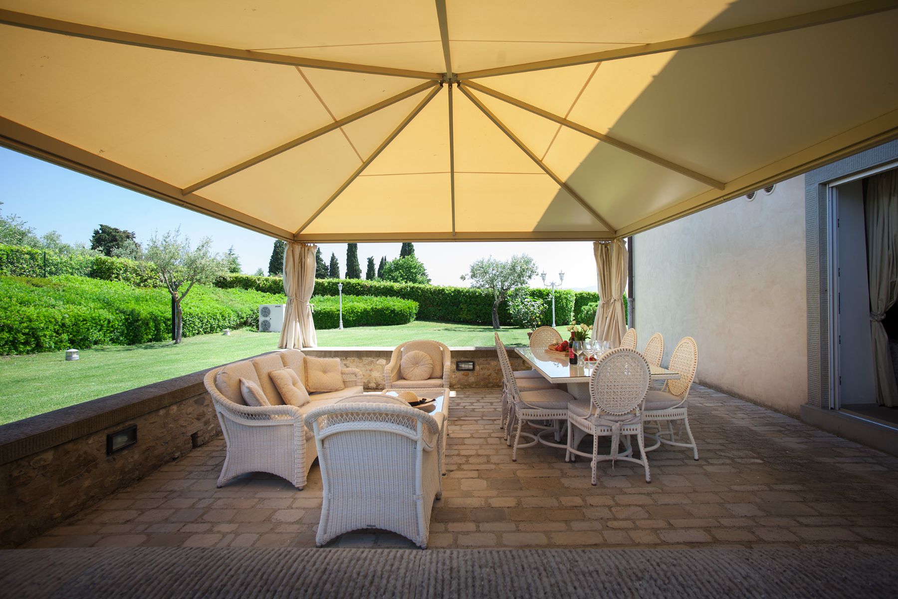 Outdoor dining tables at Villa di Tignano in Tuscany