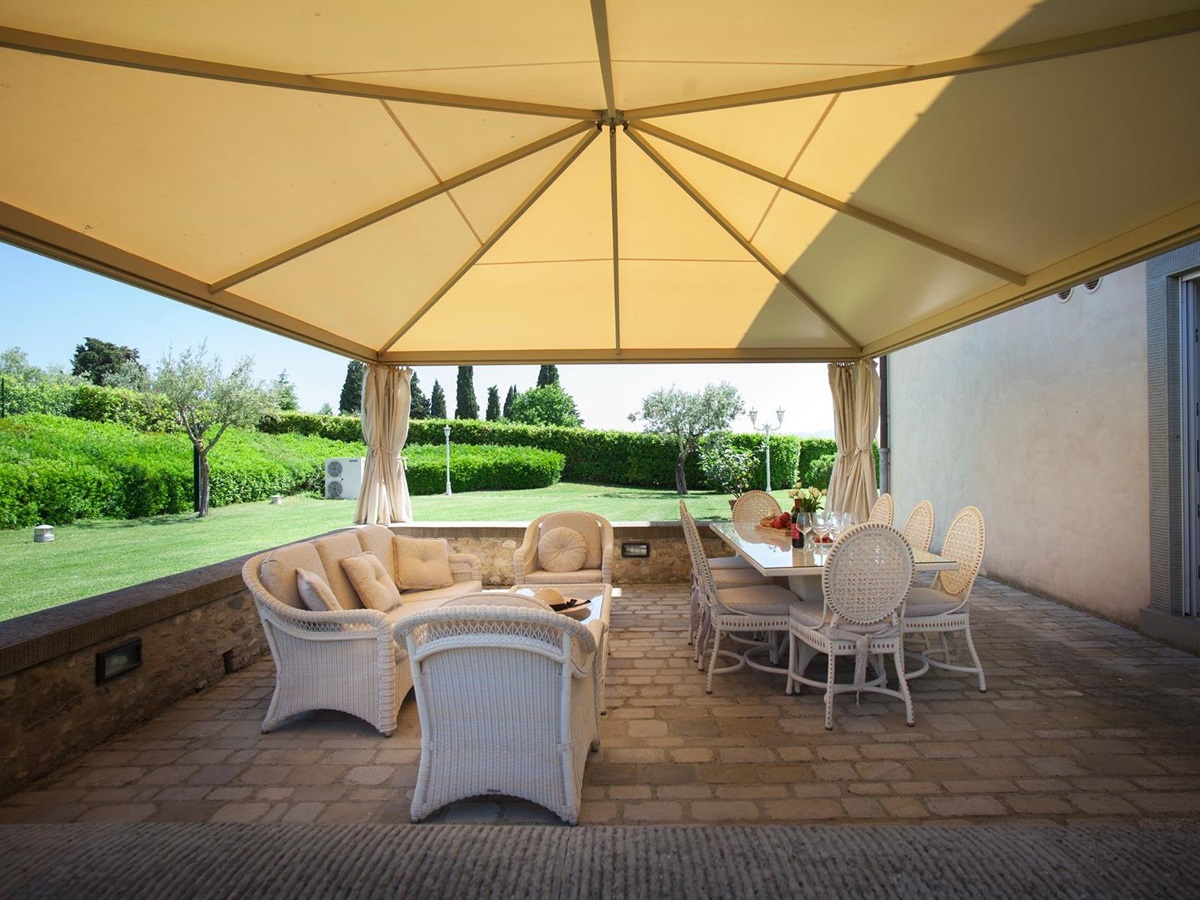 Outdoor dining tables at Villa di Tignano in Tuscany