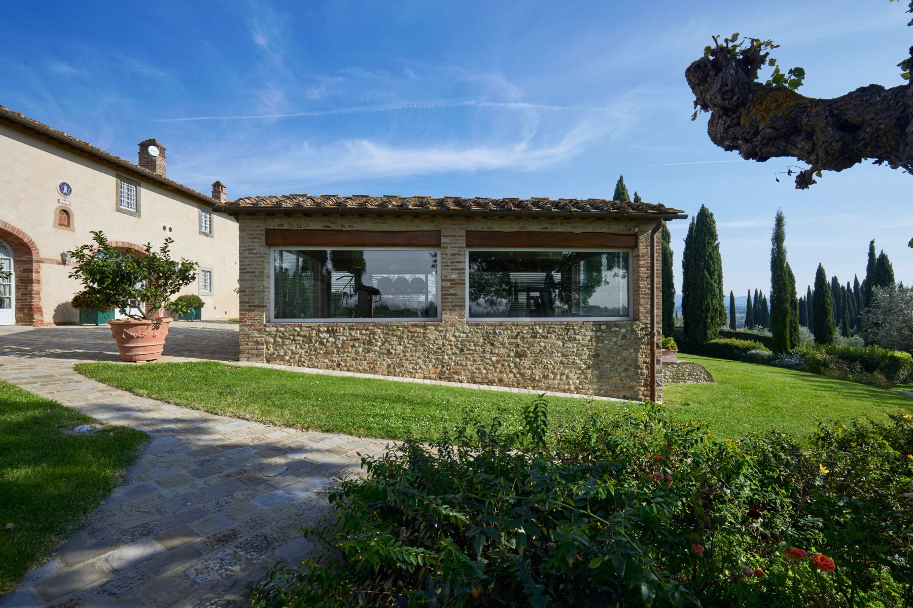 Palestra building with gym equipment inside at Villa di Tignano in Tuscany