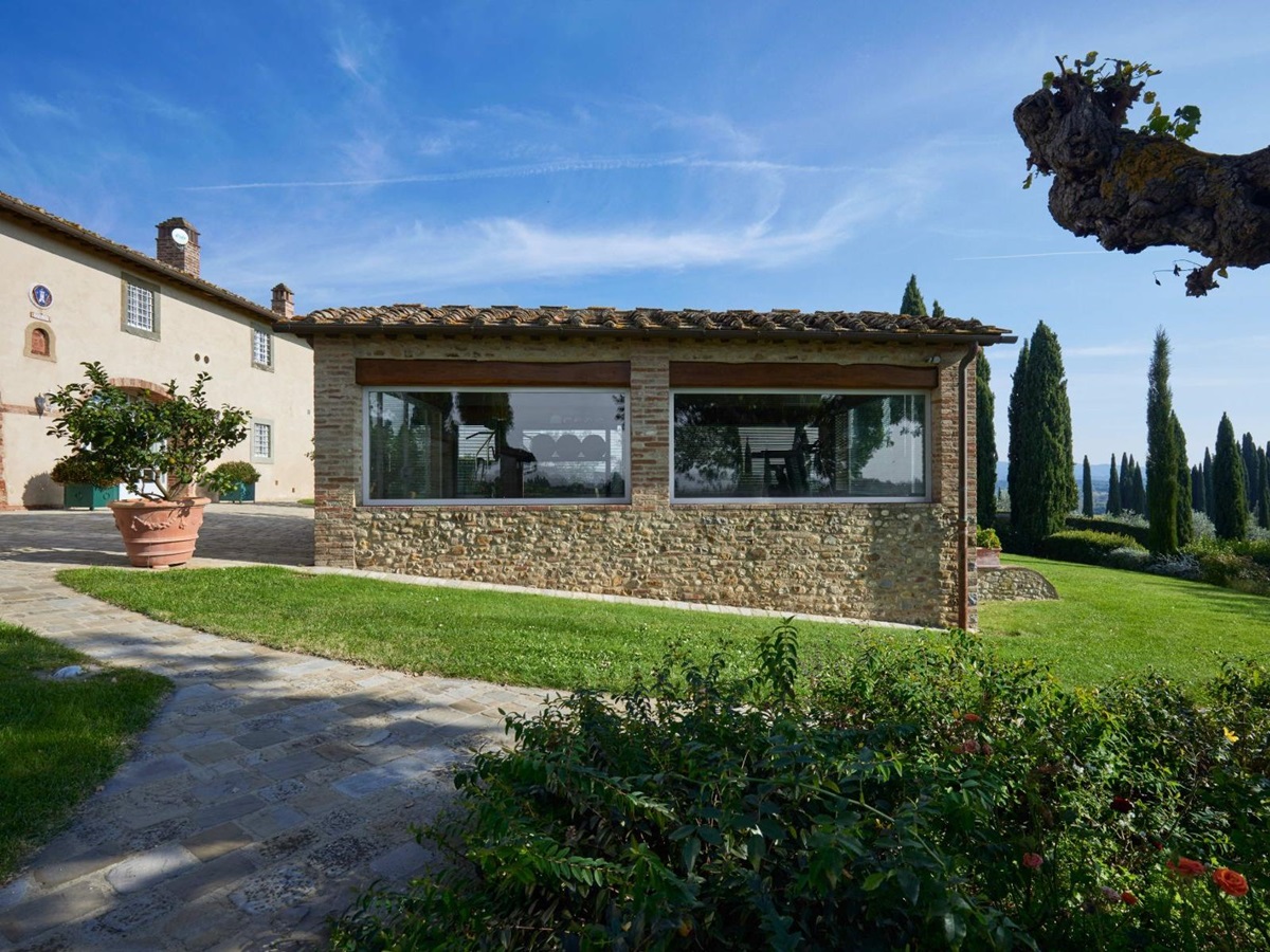 Palestra building with gym equipment inside at Villa di Tignano in Tuscany