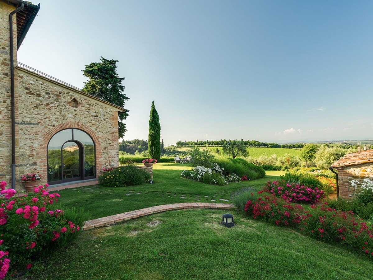 Gardens at Villa Il Sole in Tuscany, with view of the rolling hills
